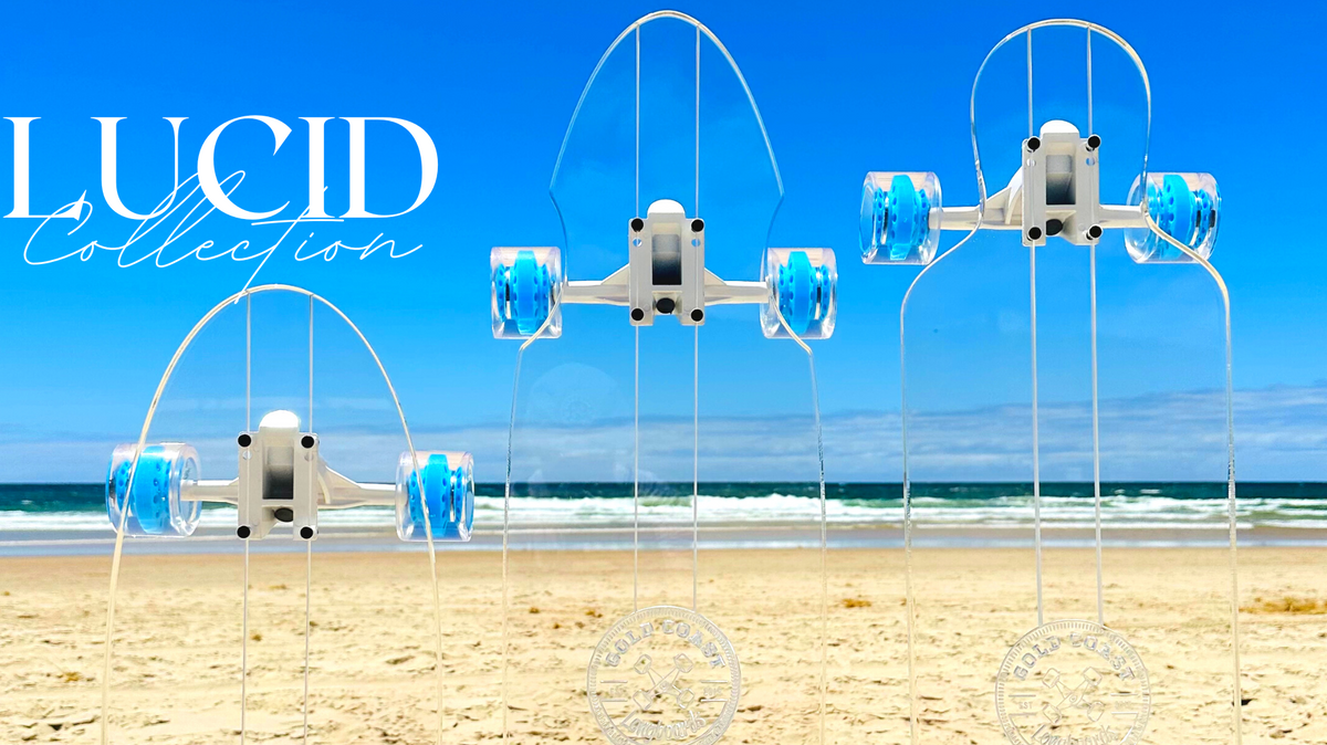 Three transparent Lucid Collection boards with engraved lines and blue wheels.