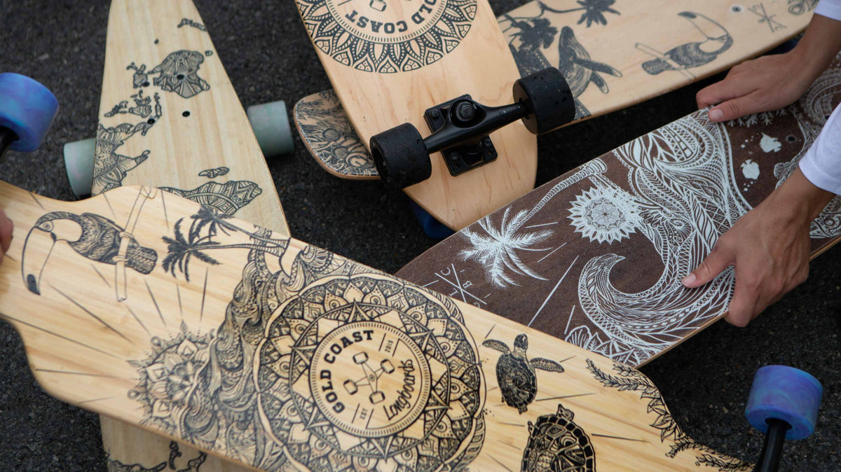 GCLB boards with different deck shapes, artwork and wheel colours gathered together.