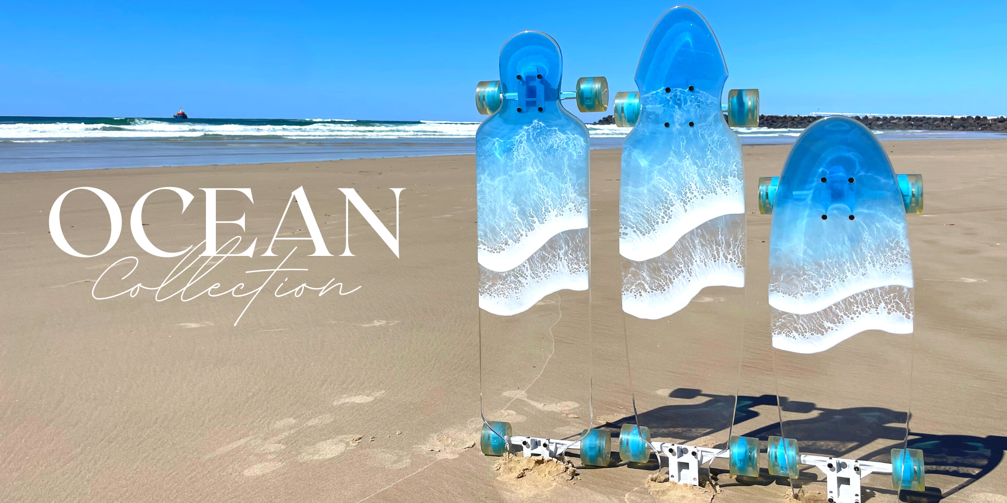 Three original Ocean Collection acrylic boards with blue and white resin wave artwork.